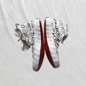 Converse Chuck Taylor white orange and black high tops